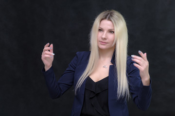 Portrait of happy smiling young cheerful businesswoman standing. Success in business concept studio shot talking to a client.