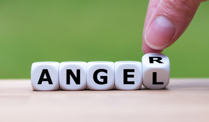 Having anger or being an angel? Hand turns a dice and changes the word "anger" to "angel".