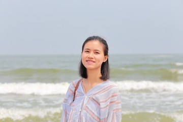 young woman at Samson beach in Vietnam