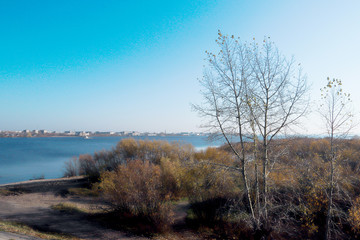 Fototapeta na wymiar Autumn day in Arkhangelsk. View of the river Northern Dvina and river port in Arkhangelsk.