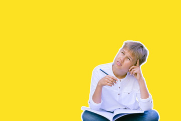 Collage in magazine style. Child learning, thinking over yellow background