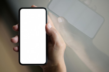 Businessman using mobile smart phone with blank screen