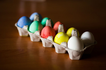 Colorful handmade easter eggs on dark background