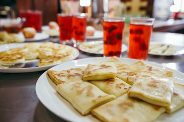 Baked apple served with pancakes and juice