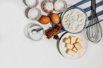 White background. Food accessories. A variety of ingredients for making dough.Top view cupcake recipe concept. Flat Lay. Copy space for text