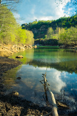 blue lake with many rocks around
