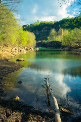 blue lake with many rocks around