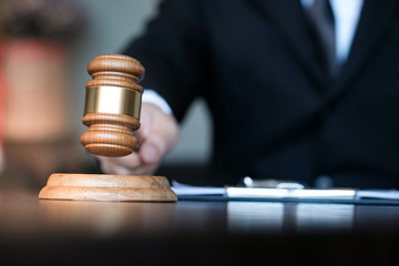 Legal counsel presents to the client a signed contract with gavel and legal law. justice and lawyer...