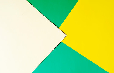Multicolored horizontal background, colored cardboard. Yellow, green and white. Copy space