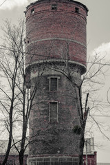 Old and gloomy abandoned water tower