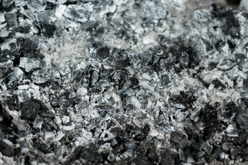 Fire ashes with dark grey black coals