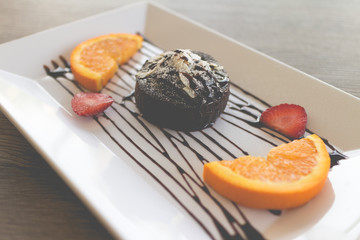 chocolate lava cake with fresh fruit and coffee