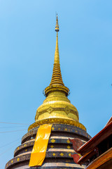 golden pagoda in public temple Wat Prathat Lampang Luang at lampang thailand