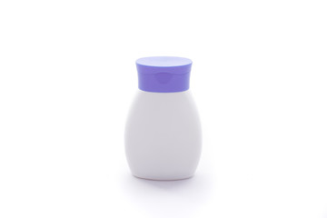 White plastic cosmetic bottle with purple cap for lotion, body milk, shampoo etc  isolated on the white background.