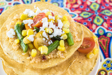 Mexican food. Veggie corn tostadas with caulflower mash.