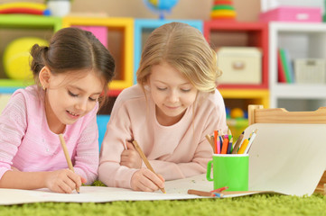 little girls drawing together
