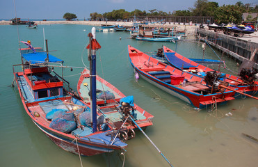 Fototapeta na wymiar Traditional thai boat at harbour in Thailand