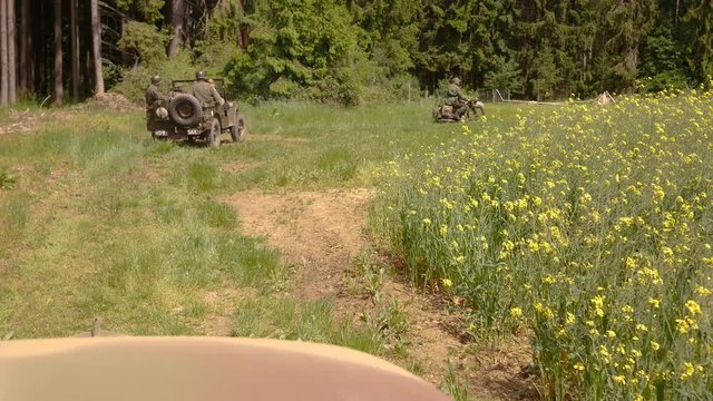 WW2 &ndash; German SS Forces escorting a captured US Jeep