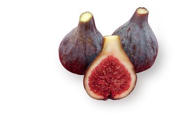 three ripe figs , one cut in half, white background side view