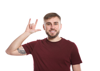 Man showing I LOVE YOU gesture in sign language on white background