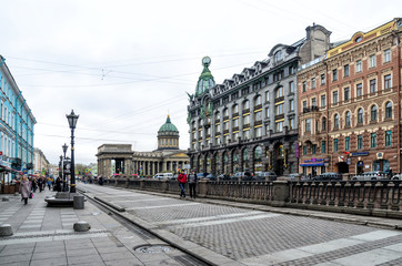 Saint Petersburg, Russia, May 2, 2015 - street near the river embankment with colored facades of houses in the early afternoon