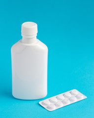 Mockup for the presentation of medicines, vitamins, tablets, capsules, pills, drugs, cough syrups. Realistic white plastic bottle and pills blister. Pharmacy product mockup.