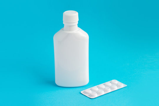 Mockup for the presentation of medicines, vitamins, tablets, capsules, pills, drugs, cough syrups. Realistic white plastic bottle and pills blister. Pharmacy product mockup.