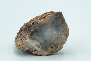 Chondrite Meteorite isolated, a piece of rock formed in outer space in the early stages of Solar System as asteroids. This meteorite comes from a meteorite fall impacting the Earth at Atacama Desert