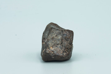 Chondrite Meteorite isolated, a piece of rock formed in outer space in the early stages of Solar System as asteroids. This meteorite comes from a meteorite fall impacting the Earth at Atacama Desert