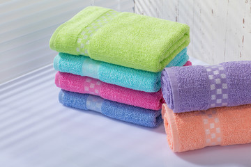 Colorful towels in bathroom.