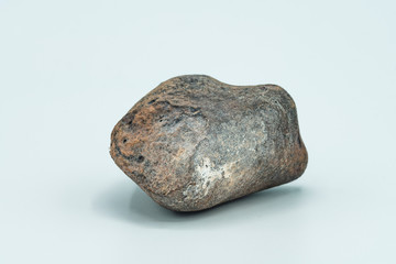 Chondrite Meteorite isolated, a piece of rock formed in outer space in the early stages of Solar System as asteroids. This meteorite comes from a meteorite fall impacting the Earth at Atacama Desert