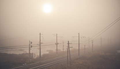 Fototapeta na wymiar Fog on the railway. Foggy Russian railway. Morning fog.