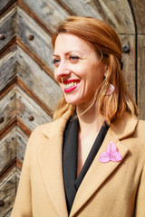 Beautiful girl on a sunny day. Dressed in classic style. Epoxy decorations. Bijouterie, earrings,...