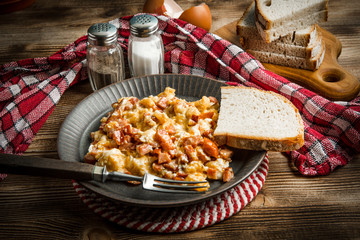 Scrambled eggs with sausage.