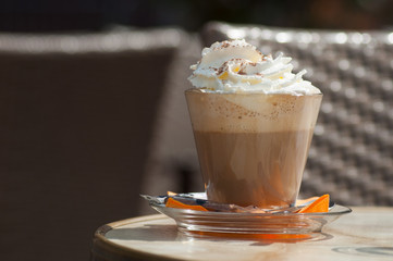 closeup of cup of cappuccino  in terrace of french bistro