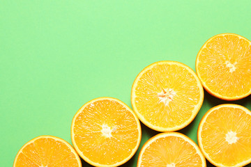 Flat lay composition with ripe oranges and space for text on color background