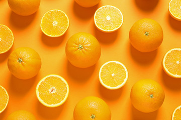 Flat lay composition with ripe oranges on color background