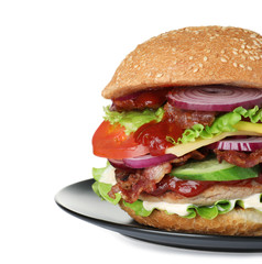 Plate with fresh tasty burger isolated on white background