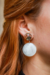 Model girl with earrings epoxy resin. Jewelry and costume jewelry. Handmade. Precious Making jewelry