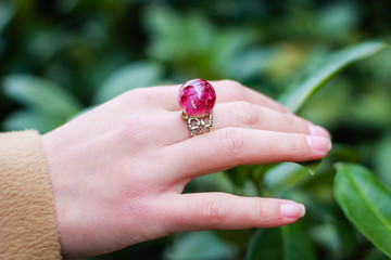 Hand model with epoxy resin ring. Jewelry and costume jewelry. Handmade. Precious Making jewelry