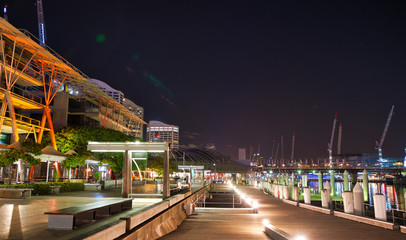 Fototapeta na wymiar Promenade of Darling Harbor at night in Sydney, Australia