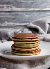 Delicious warm morning pancakes on a white plate