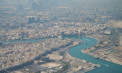 Aerial view of Dubai Creek from the airplane at sunrise