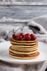 Delicious warm morning pancakes on a white plate