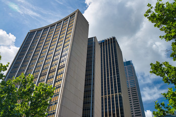 SYDNEY - OCTOBER 2015: Panoramic view of city buildings from the street. The city attracts 20 million people annually