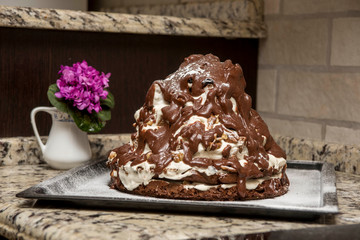 homemade cake volcano with chocolate icing
