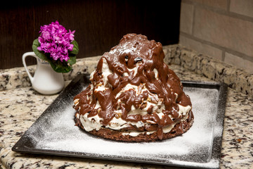 homemade cake volcano with chocolate icing