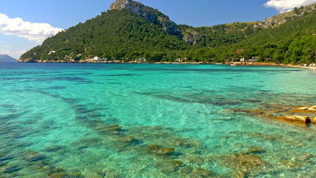 Sandy beach with azure water. Majorca Platja de Formentor beach - Mallorca at Balearic Islands of Spain