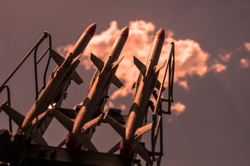 nuclear rockets pointing up into the sky. army, weapons.