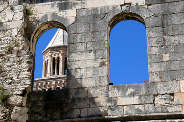 View of historical Saint Domnius bell tower and ancient Silver Gate, landmarks in Split, Croatia. 